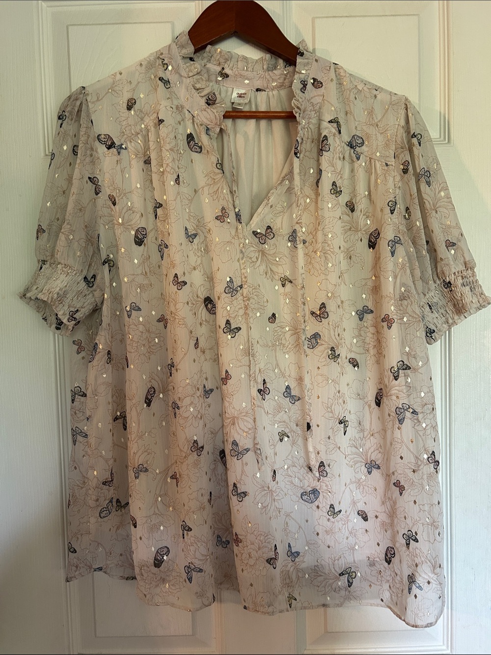 Light Beige Butterfly Print Blouse with Ruffle Neck and gold accents